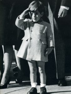 John Jr saluting at the funeral of his father