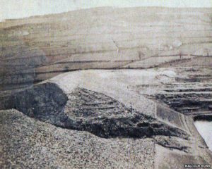 photo of the breech in the embankment in the aftermath of the disaster