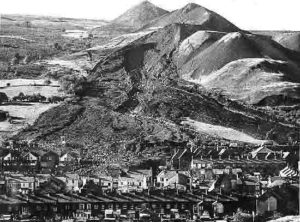 The huge looming hills of the tips over-shadowing Aberfan, in the days immediately following the disaster.