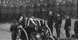King George V places wreath on the casket of the Unknown Warrior and joins the funeral procession