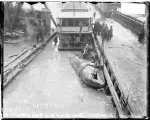 Raising of a submarine called the Fool Killer from the icy Chicago River in the Loop community area of Chicago, Illinois. Photo Credit- DN-0065726, Chicago Daily News negatives collection, Chicago History Museum.