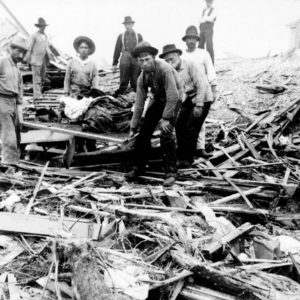 Carrying out bodies just removed from the wreckage, Galveston Photo Credit- Public Domain