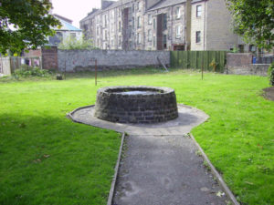  On a small patch of land, just off Queen Street in the West End, lies this well which  is all that remains of the Gallowgreen where the Paisley Witches were killed.  Photo Credit- http://paisleyonline.co.uk/