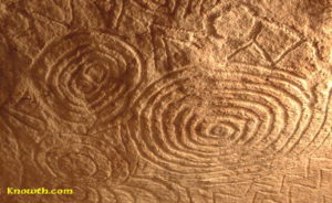 Megalithic art carved on the underside of the roof stone in the east recess off the main chamber inside the mound at Newgrange. Photo Credit- Knowth.com